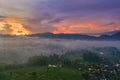 Aerial view of fog covering plantation and village Royalty Free Stock Photo