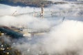 Aerial view of fog over Bath Iron Works and Kennebec River in Maine. Bath Iron Works is a leader in surface combatant design and Royalty Free Stock Photo