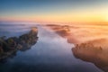 Aerial view of foggy forest at colorful sunrise in autumn Royalty Free Stock Photo