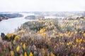 Aerial view of foggy lake and colorful forests on a autumn day in Finland. Drone photography Royalty Free Stock Photo