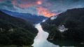 Aerial view of a foggy sunset over Siriu lake