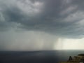 Aerial view footage of rain clouds over sea ocean Black clouds in bad weather day over sea surface High angle view Royalty Free Stock Photo