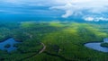 Aerial view of forest in Algonquin park,Canada with green trees, rivers,lakes and a cloudy sky above