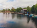 Aerial view of forest and blue lake with clouds reflection in Finland. Sauna house by the lake shore. Wooden pier with Royalty Free Stock Photo