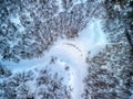 Aerial view of the forest in winter time with footsteps on the trail Royalty Free Stock Photo