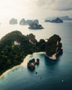 Aerial view of a forested green rocky island with a sandy beach in Thailand, Krabi, Ko Hong