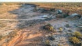 Aerial view of four wheel drive vehicle and large caravan camped