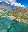 Aerial view of Frankton Arm valley New Zealand with majestic mountain peaks and turquoise water of Frankton Arm.