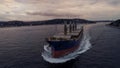 Aerial view of freight ship with cargo containers.