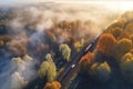 Aerial view of freight train in beautiful forest in fog at sunrise in autumn. Colorful landscape with railroad Royalty Free Stock Photo