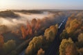 Aerial view of freight train in beautiful forest in fog at sunrise in autumn. Colorful landscape with railroad Royalty Free Stock Photo