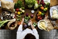 Aerial view of fresh organic various vegetable on wooden table