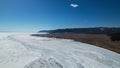 Aerial view of frozen lake Baikal in winter season, the surface of lake covered by huge snow Royalty Free Stock Photo