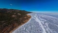 Aerial view of frozen lake Baikal in winter season, the surface of lake covered by huge snow Royalty Free Stock Photo