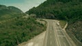 Aerial view of a fuel tank truck driving along the mountain road. Oil or gasoline transportation Royalty Free Stock Photo