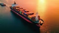 Aerial view of a fully loaded container ship leaving cargo terminal escorted by tugboat and sailing into the ocean