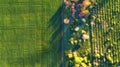 Aerial view at the garden and field. Agricultural landscape from air. Field and garden. Farm at summer time. Drone photography. Royalty Free Stock Photo