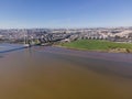 Aerial view of a garden park facing the Tagus river next the Vasco da Gama bridge with Trancao river and Lisbon residential Royalty Free Stock Photo