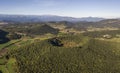 Aerial view of Garrotxa Volcanic Zone Natural Park and Santa Margarida Volcano in the foreground