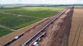 Aerial view of gas and oil pipeline construction. Pipes welded together. Big pipeline is under construction Royalty Free Stock Photo