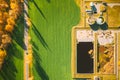 Aerial view gas station in sunny autumn rural landscape. Elevated view flat view gas station standing in a field in