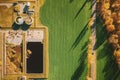 Aerial view gas station in sunny autumn rural landscape. Elevated view flat view gas station standing in a field in