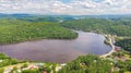 Aerial View of the Gatineau River near the village Wakefield, Canada. Clouds reflecting in the river water, a street with cars Royalty Free Stock Photo