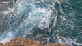 Aerial view of giant blue waves breaking on the rocks during the surf. Action. Sea element Royalty Free Stock Photo