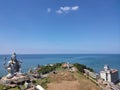 An aerial view of giant 123 feet shiva statue with an ocean background