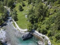 Aerial view of the giant rock called the Bidet della Contessa in the Val di Mello, a green valley. Sondrio. Italy