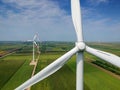 Aerial View of Giant Wind Turbine Rotating in Strong Winds - Green Energy