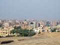 Aerial view of Giza Egypt with fields at the country side and modern buildings and crowded houses