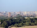 Aerial view of Giza Egypt with fields at the country side and modern buildings and crowded houses