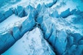 aerial view of glacier with multiple crevasses