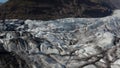 Aerial view of glacier texture at Breidamerkurjokull glacier tongue in Iceland. Scenic drone view of snow capped