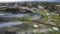 Aerial view of a Gleneagles Golf course along the rural road, on a sunny day, with a forest near it Royalty Free Stock Photo