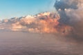 Aerial view of golden clouds lit by the evening sun over Florida, view from the aircraft during the flight. Royalty Free Stock Photo