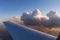 Aerial view of golden clouds lit by the evening sun over Florida, view from the aircraft during the flight. Royalty Free Stock Photo