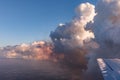 Aerial view of golden clouds lit by the evening sun over Florida, view from the aircraft during the flight. Royalty Free Stock Photo