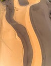 Aerial View of Golden Sand Dunes with Textured Patterns and Soft Lighting Royalty Free Stock Photo
