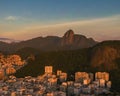 Aerial view of golden sunrise over Rio de Janeiro, Brazil, and Christ's statue on mountain Corcovado