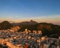 Aerial view of golden sunrise over Rio de Janeiro, Brazil, and Christ's statue on mountain Corcovado