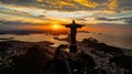 Aerial view of a golden sunset illuminating the statue of Jesus Christ in Rio de Janeiro, Brazil.
