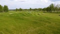 Aerial view Golf course. Golfers walking down the fairway on a course with golf bag and trolley Royalty Free Stock Photo