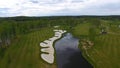 Aerial view Golf course, ponds and green lawns of the Golf course. Sand bunkers at the beautiful golf course Royalty Free Stock Photo