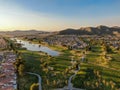 Aerial view of golf course surrounded by town houses and luxury villas during sunset time, Temecula Royalty Free Stock Photo