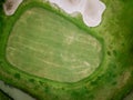 Aerial view of golf hole with flag in golf course Royalty Free Stock Photo