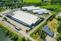 Aerial view of goods warehouse. Logistics center in industrial city zone from above. Aerial view of trucks loading at logistic Royalty Free Stock Photo