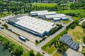 Aerial view of goods warehouse. Logistics center in industrial city zone from above. Aerial view of trucks loading at logistic Royalty Free Stock Photo