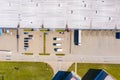 Aerial view of goods warehouse. Logistics center in industrial city zone from above. Aerial view of trucks loading at logistic Royalty Free Stock Photo